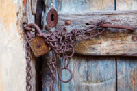 rusty-door-lock-and-chain-on-an-old-door-PWUEPGN-1199x800.jpg
